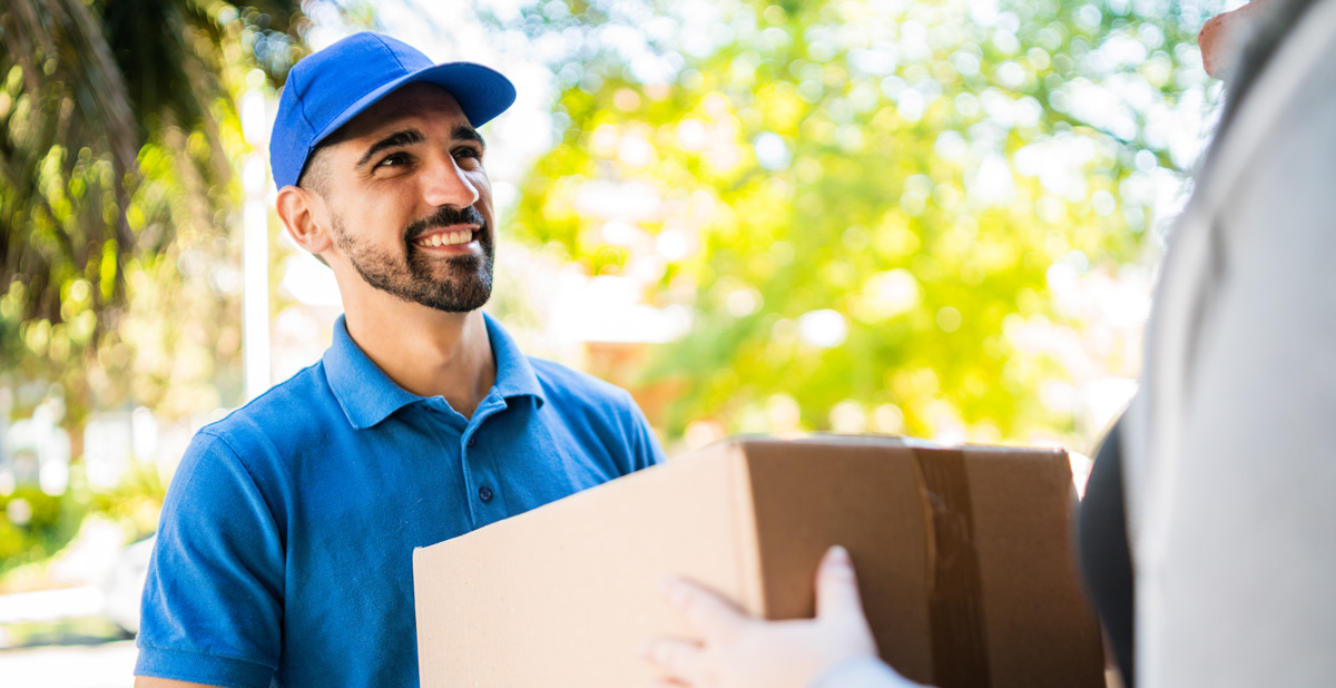 delivery-man-handing-a-package-to-customer-outdoor