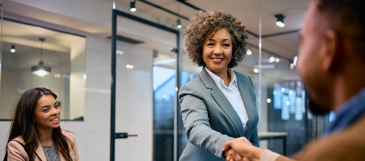 happy-solicitor-handshaking-with-client